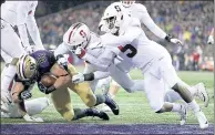  ?? ABBIE PARR — GETTY IMAGES ?? Washington’s Drew Sample scores in the first quarter during the Huskies’ hot start in a 27-23 win over Stanford Saturday.