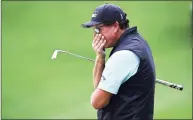  ?? Jeff Siner / Associated Press ?? Phil Mickelson reacts after missing a putt on the 15th green during the second round of the Wells Fargo Championsh­ip on Friday.