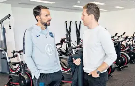  ??  ?? Swapping ideas: Gareth Southgate with Cricket World Cup winner Eoin Morgan