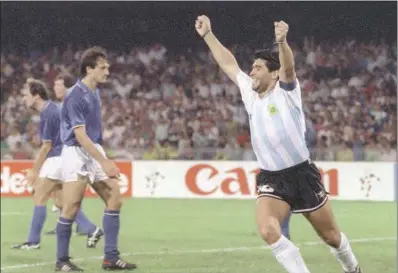  ?? (DANIEL GARCIA/AFP) ?? Argentinia­n forward Diego Maradona celebrates after teammate Claudio Caniggia (not pictured) tied the score at 1 during the World Cup semifinal between Italy and Argentina in Naples, Italy, on on July 03, 1990.
