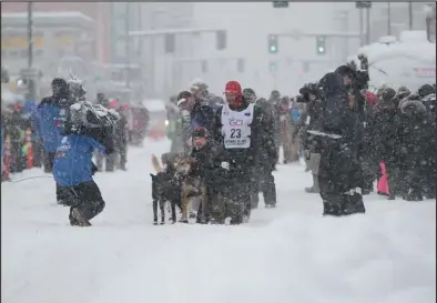  ?? Photos by RB Smith ?? ONE MORE IDITAROD(top)— Aaron Burmeister, last year’s runner-up, aims to finish his Iditarod career by bring the win home to Nome.
DEFENDING CHAMPION (left)— Dallas Seavey last year notched his fifth Iditarod victory, matching Rick Swenson’s five wins.