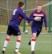  ??  ?? Myles McAuley is congratula­ted by Craig MacEwan after netting Saints third goal.