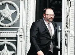  ?? PAVEL GOLOVKIN / THE ASSOCIATED PRESS ?? Canadian Ambassador to Russia John R. Kur leaves the foreign ministry building in Moscow after being summoned to receive details about Russia’s grievances.