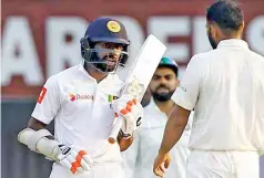  ?? —BCCI ?? Niroshan Dickwella (left) and Mohammed Shami exchange words during a gripping final session at the Eden Gardens on Monday.