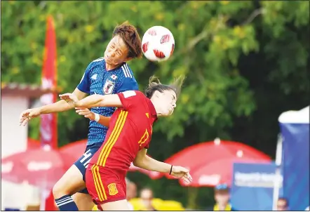  ??  ?? Japan’s defender Moeka Minami (left), vies with Spain’s forward Lucia Garcia during the Women World Cup U-20 match Japan vs Spain on Aug 9, atthe Guy Piriou Stadium in Concarneau, western France. (AFP)