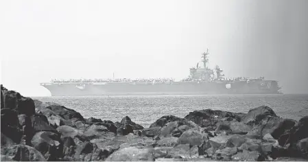  ??  ?? The aircraft carrier USS Carl Vinson arrives Monday off the coast of Da Nang, Vietnam. EPA-EFE