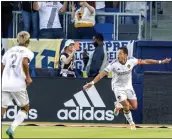  ?? ALEX GALLARDO — THE ASSOCIATED PRESS ?? Galaxy forward Chicharito Hernandez, right, celebrates after scoring in the ninth minute against CF Montreal on Monday.