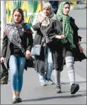  ?? (AFP) ?? Iranian women walk at Sadeqyeh Square in the capital Tehran. After a ban spanning decades, Iranian women are set to freely enter a football stadium for the first time on October 10 as Iran host Cambodia in a World Cup 2022 qualifier at the Azadi Stadium.