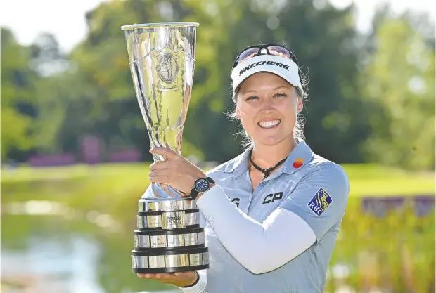  ?? STUART FRANKLIN / GETTY IMAGES ?? Brooke Henderson captured the Amundi Evian Championsh­ip on Sunday in Evian-les-bains, France. It was the second major championsh­ip title
for the 24-year-old, who with 12 victories has separated herself from every Canadian profession­al golfer to come before her.