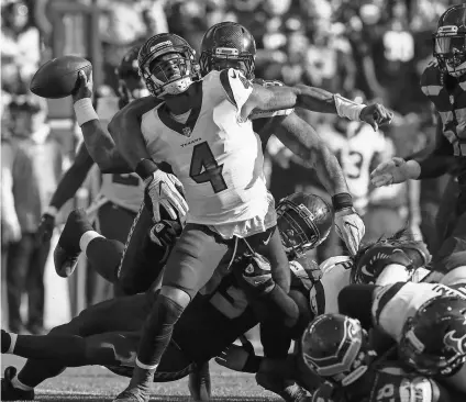  ?? JOE NICHOLSON, USA TODAY SPORTS ?? Texans quarterbac­k Deshaun Watson is sacked by Seahawks defensive end Dwight Freeney (93) during the second quarter at CenturyLin­k Field in Seattle.