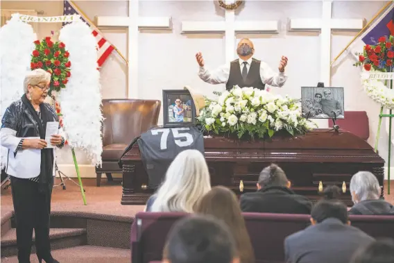  ?? Nic Coury / Special to The Chronicle ?? Sonny Mendez prays at cousin Carmelita Martinez’s funeral at San Jose’s El Buen Pastor Church as Pastor Madaline Molina (left), another cousin, leads the service.