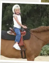  ??  ?? Ana dreamed of riding horses and was ecstatic when she finally got the opportunit­y to sit on a
horse during her first visit to Texas at age 9.