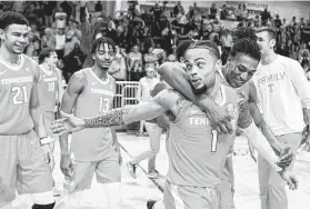  ?? Mark Wallheiser / Associated Press ?? Tennessee guard Lamonte Turner (1) was the center of attention Saturday after sinking a 3-pointer at the buzzer to lift the No. 17 Volunteers over No. 20 VCU.