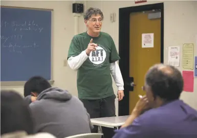  ?? Liz Hafalia / The Chronicle ?? Tim Killikelly, president of the American Federation of Teachers Local 2121, teaches a course on the politics of globalizat­ion at City College of San Francisco. “We don’t take this lightly,” he says of Wednesday’s strike.