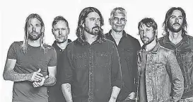  ?? PROVIDED BY BRANTLEY GUTIERREZ ?? Grohl, center, and Foo Fighters celebrate their 25th year with “Medicine at Midnight,” out Friday.