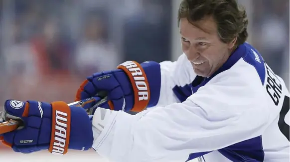  ?? JOHN WOODS/THE CANADIAN PRESS ?? NHL legend Wayne Gretzky was back on blades in Winnipeg — tuning up for Saturday’s Heritage Classic outdoor alumni game between Oilers and Jets greats. The NHL clubs square off Sunday.
