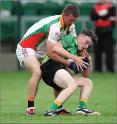  ??  ?? Kiltegan’s Rory Finn tackles Hollywood’s Matthew Kelly.