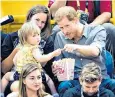  ??  ?? Emily Henson helped herself to Prince Harry’s popcorn at the Invictus Games