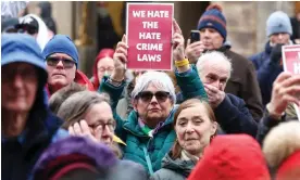  ?? Photograph: Jeff J Mitchell/Getty Images ?? Protesters rally outside Holyrood against the SNP's hate crime bill, which came into force on Monday.