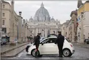  ?? CECILIA FABIANO — LAPRESSE ?? Italian Carabinier­i officers check vehicles in front of St. Peter’s Basilica at the Vatican on Thursday.