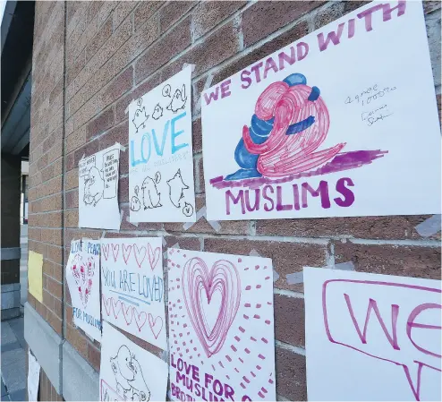  ?? STAN BEHAL / POSTMEDIA NEWS ?? Signs of support for Muslims were posted on the wall of the Masjid on Monday in downtown Toronto.