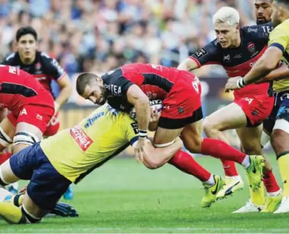  ??  ?? PARIS: Toulon’s Daniel Johannes Vermeulen is tackled by Clermont’s Arthur Iturria during the Top 14 finalrugby match between Clermont Ferrand against Toulon at the Stade de France stadium in Saint-Denis, north of Paris, Sunday. — AP