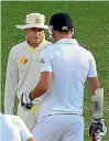  ??  ?? Michael Clarke, left, warns Jimmy Anderson of a impending arm imjury.