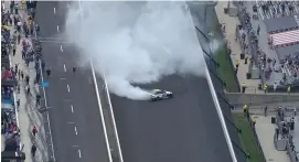  ?? (Getty Images) ?? AJ Allmending­er with the epic burnout Sunday at Indianapol­is after winning the Cup Series’ first road-course race at the iconic track.