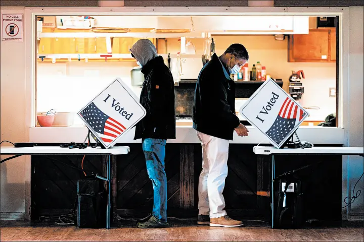  ?? CAMERON POLLACK/THE NEW YORK TIMES ?? Voters cast their ballots Nov. 3 at a church in Sullivan's Island, South Carolina. One possible explanatio­n for 2020’s polling misfire involves higher turnout of registered voters.