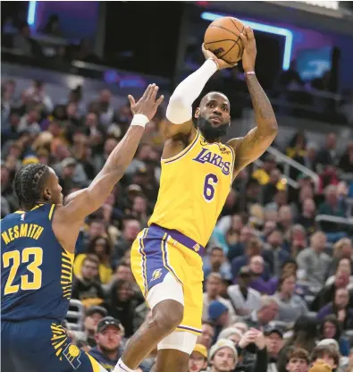  ?? MICHAEL CONROY/AP ?? LeBron James is 35 points away from Kareem Abdul-Jabbar’s NBA record of 38,387. The Lakers host the Thunder on Tuesday.
