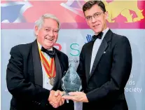  ??  ?? Lord Naseby (Left) receiving the award from British High Commission­er James Dauris