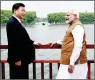  ?? PTI ?? PERFECT SETTING: Indian PM Narendra Modi with Chinese President Xi Jinping along the East Lake in Wuhan, China, on Saturday. —