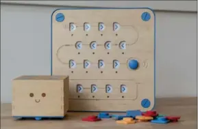  ?? ANDREW TESTA, NEW YORK TIMES ?? Cubetto, a wooden robot developed by Primo Toys, helps children as young as three learn the basics of computer programmin­g.
