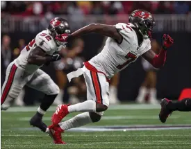  ?? DANNY KARNIK — THE ASSOCIATED PRESS ?? Tampa Bay Buccaneers linebacker Shaquil Barrett (7) works during the second half against the Atlanta Falcons on Dec. 10 in Atlanta. The Miami Dolphins added needed linebacker help on Tuesday, agreeing to terms with veteran Barrett on a one-year contract, according to a person familiar with the deal.