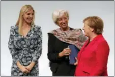  ?? MARKUS SCHREIBER - THE ASSOCIATED PRESS ?? Ivanka Trump, daughter and adviser of U.S. President Donald Trump, Internatio­nal Monetary Fund Managing Director Christine Lagarde and German Chancellor Angela Merkel, from left, chat after a panel at the W20 Summit in Berlin Tuesday. The conference...