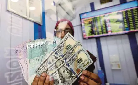  ??  ?? MIDF Research says the effects of external concerns, such as trade tensions between the United States and China as well as the strengthen­ing of the US dollar, still linger.