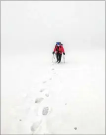  ?? Marc Vartabedia­n ?? CLIMBING any of Mt. Aragats’ peaks in June involves hiking through snow and sometimes storms that obscure visibility.