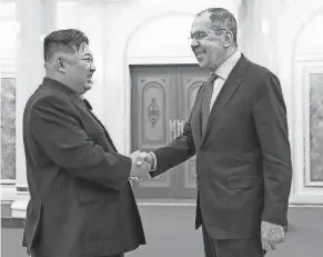  ?? RUSSIAN FOREIGN MINISTRY PRESS SERVICE TELEGRAM CHANNEL VIA AP ?? North Korean leader Kim Jong Un and Russian Foreign Minister Sergey Lavrov meet Thursday. Lavrov arrived in the North Korean capital, Pyongyang, Wednesday.