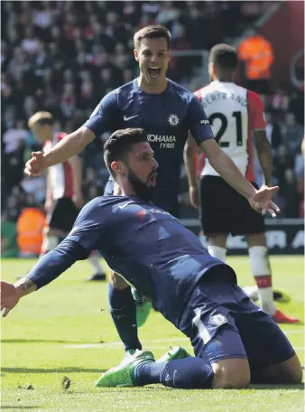  ?? Getty ?? Olivier Giroud, kneeling, scored his first two goals to lift Chelsea over Southampto­n. Wilfried Zaha, below right, also scored twice in Crystal Palace’s 3-2 win over Brighton