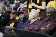  ?? DAVID GOLDMAN — THE ASSOCIATED PRESS ?? Members of the 1963 Loyola-Chicago basketball team, from left, Jerry Harkness, Les Hunter, John Egan and Rich Rochelle watch the second half of a regional semifinal against Nevada in Atlanta Thursday.