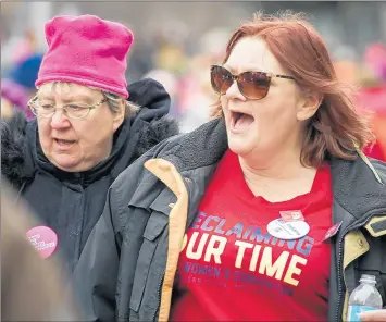  ?? DOUG MCSCHOOLER/POST-TRIBUNE 2018 ?? Julie Storbeck, right, is president of the Northwest Indiana chapter of National Organizati­on for Women. The Trump administra­tion has “attacked every single pillar of NOW,” she said.