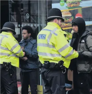  ??  ?? Police using stop and search in the Dale End area of Birmingham city centre