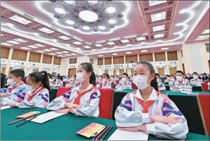  ?? YUE YUEWEI / XINHUA ?? A ceremony marking the 100th anniversar­y of the founding of the Communist Youth League of China is held in the Great Hall of the People in Beijing on Tuesday.