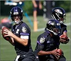  ??  ?? In this June 14 file photo, Baltimore Ravens quarterbac­ks Joe Flacco (from left) Robert Griffin III and Lamar Jackson run a drill during an NFL football practice at the team’s headquarte­rs in Owings Mills, Md. AP PhoTo/PATrIck SemAnSky