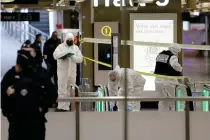  ?? AFP PHOTO ?? FOLLOWING PROCEDURE
Police in hazmat suits collect evidence following a knife attack at the Gare de Lyon train station in France’s capital Paris on Saturday, Feb. 3, 2024.