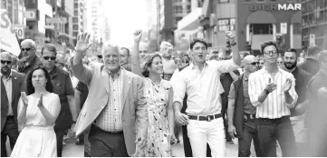  ??  ?? Trudeau (second right) leading the 2018 Montreal Pride parade along with his wife Sophie (third right), Canadien actor Antoni Porowski (right), Quebec Prime minister Philippe Couillard (second from left) and Montreal mayor Valerie Plante (left) in Montreal, Quebec. — AFP photo