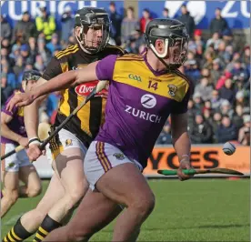  ??  ?? Wexford goalscorer Conor McDonald trying to get away from Walter Walsh.