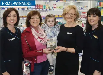  ??  ?? Martina and Darcy Doyle receive their prize of a hotel break from Laura Armstrong, Beverly Rowlands and Louise Foster of Armstrong Life Pharmacy on the Wexford Road in Arklow.