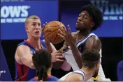  ?? CARLOS OSORIO — THE ASSOCIATED PRESS ?? Warriors center James Wiseman grabs a rebound next to Pistons center Mason Plumlee, left, during the first half on Tuesday in Detroit.