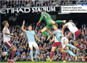  ??  ?? Ederson leaps into action against Burnley